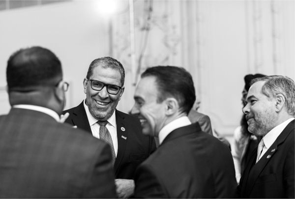 Image of Mohamed Lachemi greeting guests at Economic Club and an image of student Vathsala Illesinghe