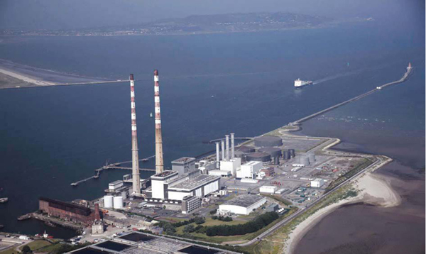 Image shows an aerial view of Poolbeg. We can see the chimley and howth in the backgrounf/