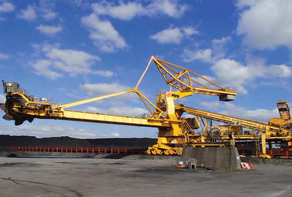 Wide angle pic of a crane at a power station.